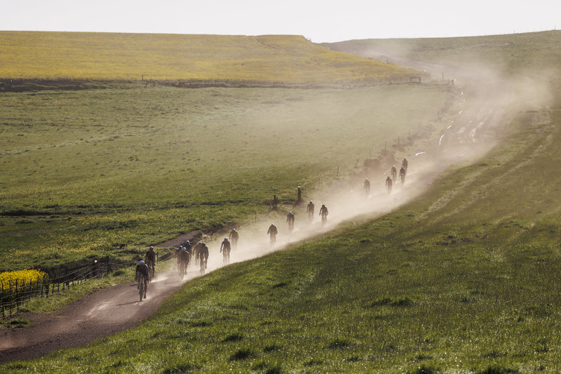 First light, open gravel, and a ribbon of riders trailing dust across the Overberg. Photo by Sam Clark