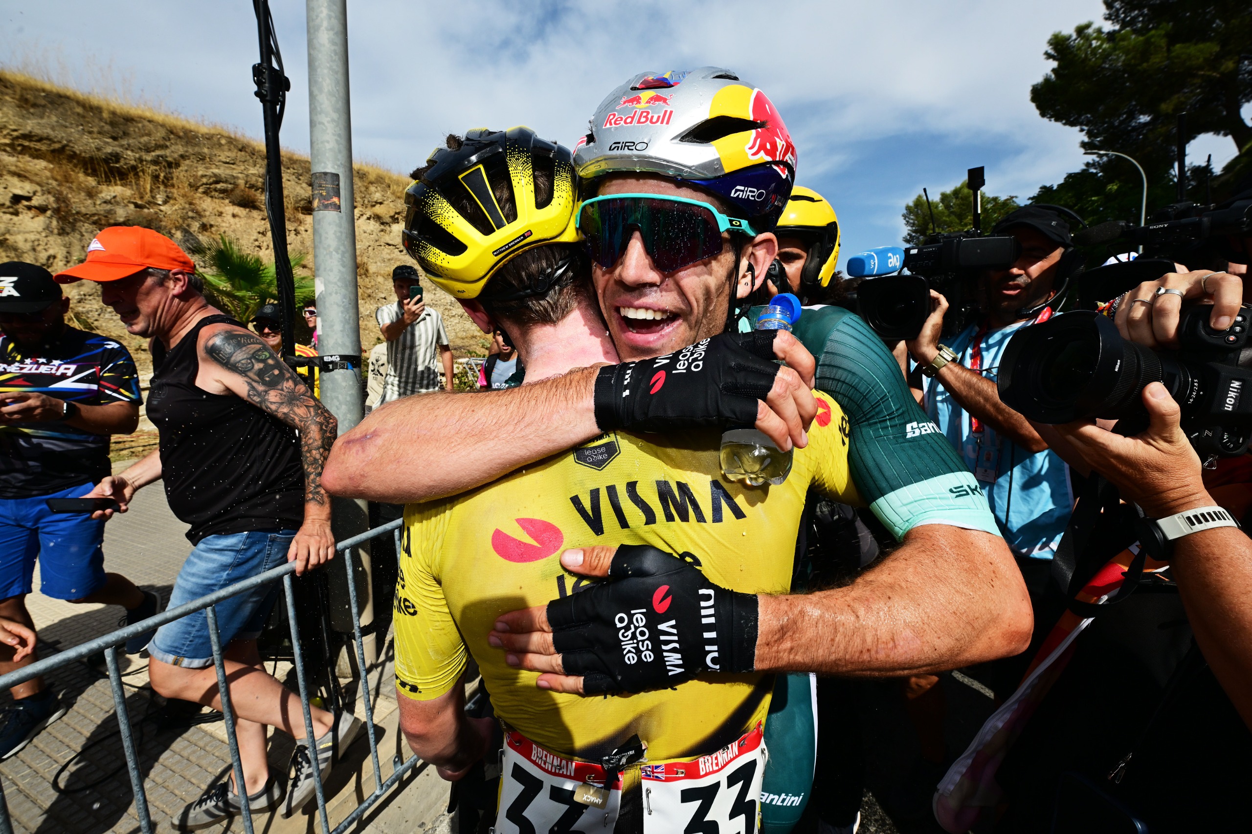 Vuelta stage 13 - Wout van Aert hugging Matthew Brennan at the Vuelta a EspaƱa